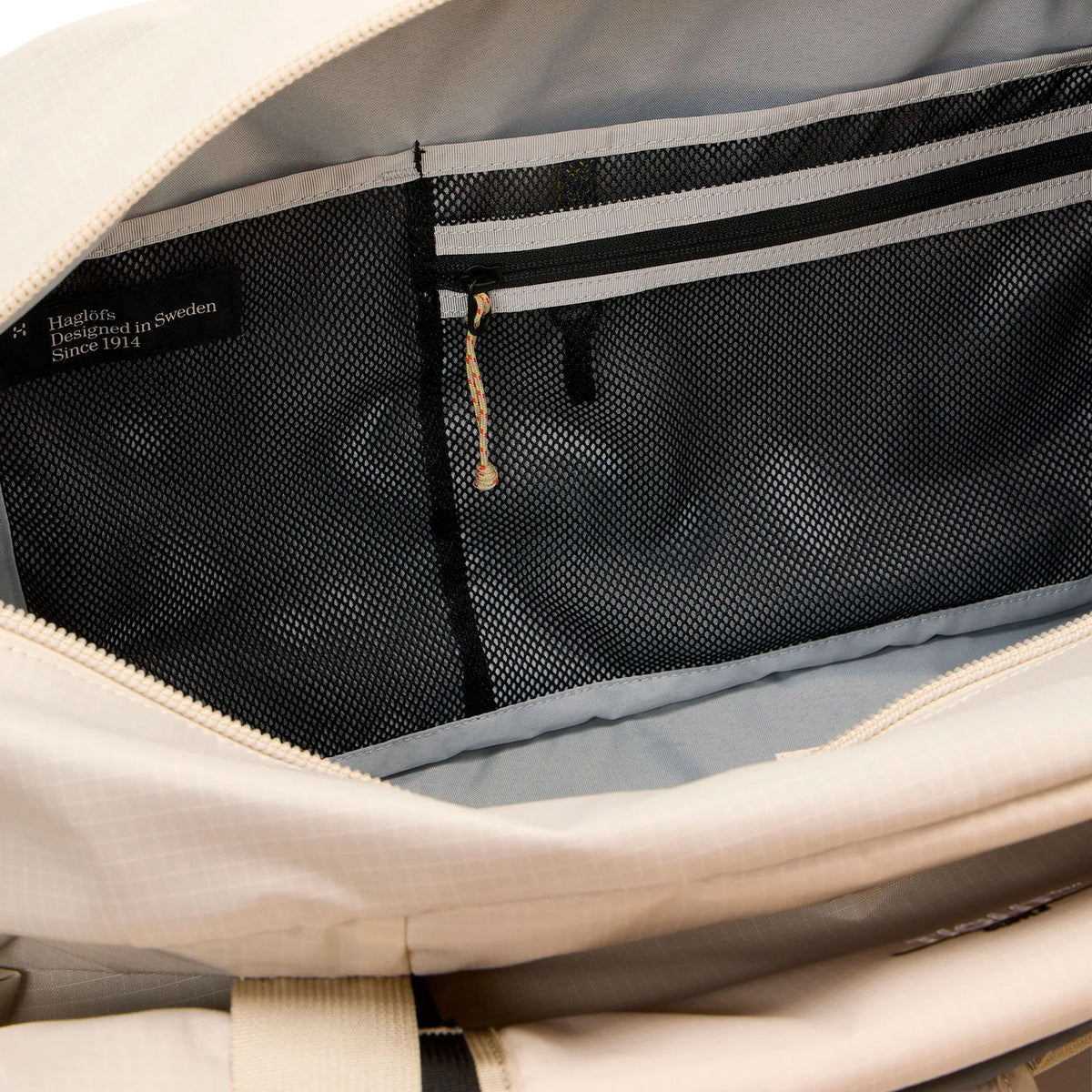 Tight duffle 50, chalk beige, vetoketjullinen sisätasku